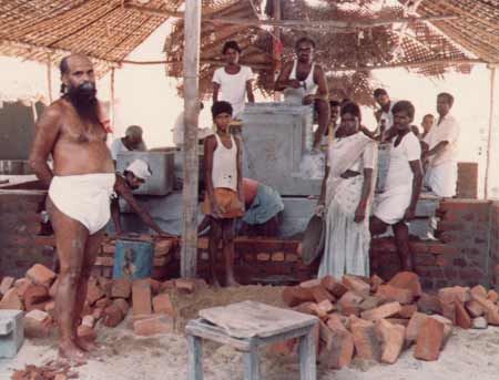 Temple construction being overseen by Tavatiru Bala Murugan Adimai